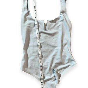 Light blue one piece bodysuit with buttons detail